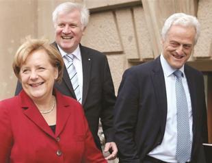 Merkel and defeated rivals set to seek grand coalition