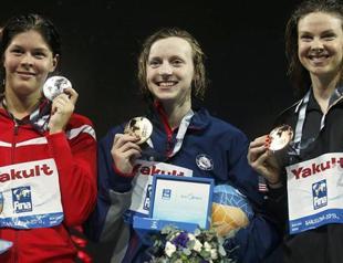Ledecky claims second world record, fourth gold