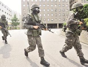 North Korea warns of counter-attack on US warship