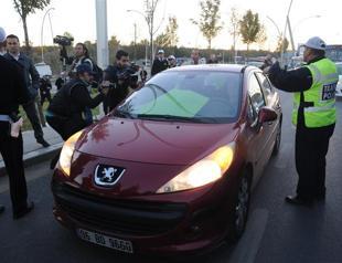 Protester blocks road with car to protest ODTÜ road project