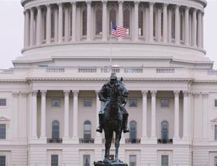 Fitch warns it may cut US rating from AAA