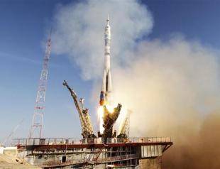 Russia launches Sochi Olympic torch into space