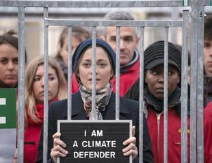 Frances oscar-winning actress Marion Cotillard in caged protest for Greenpeace activists in Russia