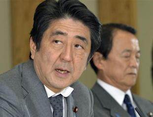 Japan approves $182 bln economic package, doubts remain