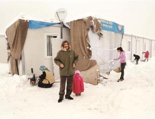 Quake-hit families in Van continue to freeze in container homes