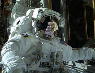 NASA astronauts step out on Christmas Eve spacewalk