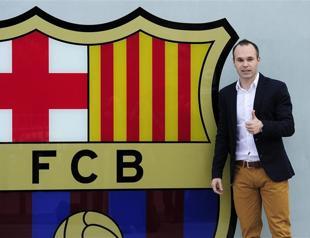 Andres Iniesta signs with Barcelona until 2018