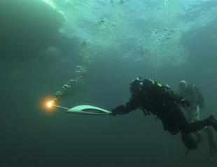 Olympic flame plunges into Russias lake Baikal