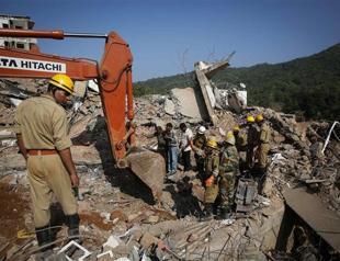 Rescuers race to find 20 still trapped in India building collapse
