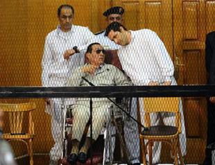 Egypt court acquits ex-PM, Mubarak sons of corruption