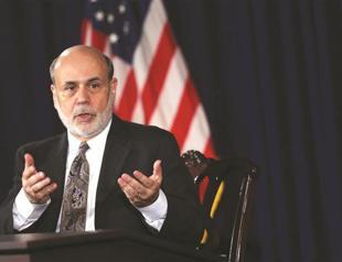 US Fed cuts bond buying in first step away from historic stimulus