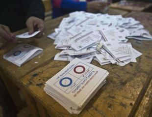Egypt voters overwhelmingly back constitution- official sources