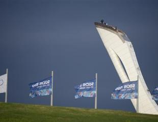 Olympic torch in Sochi amid protests over anti-gay law