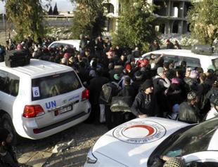Homs evacuations resume as Syria peace talks falter