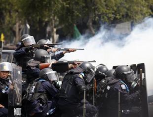 Four killed in Thai clashes; PM to face charges over rice scheme