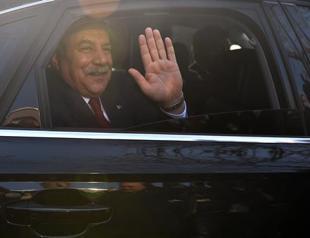 Implicated interior minister fires off parting shot during handover