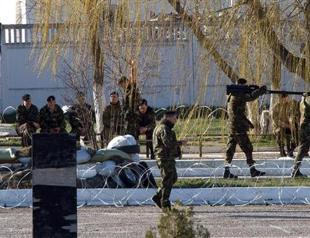 Russian troops seize Ukraine marine base in Crimea