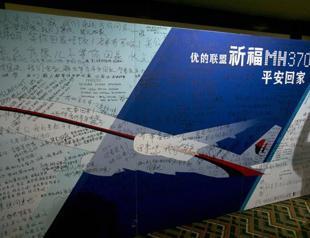 Chinese plane sees floating white objects in search for Malaysian jet