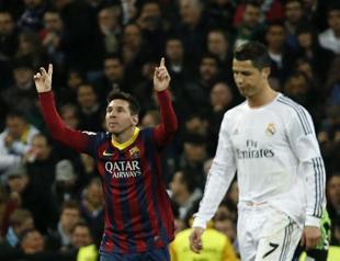 Messi blows title race open with treble at Real