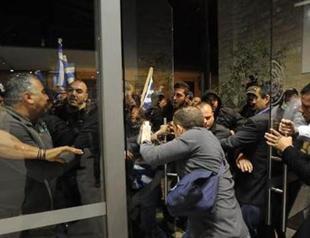 Former Turkish Cypriot president attacked by nationalists in Greek Cyprus