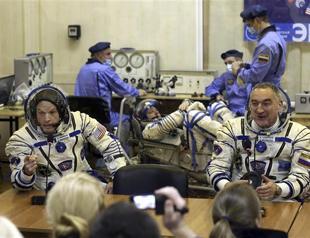 NASA suspends Russia ties, except on space station