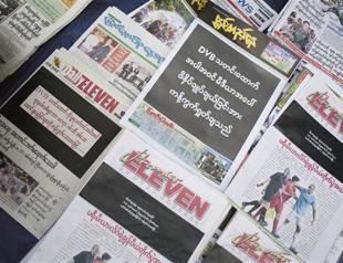Newspapers in Myanmar print black front pages to protest sentencings