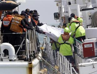 First bodies pulled from submerged South Korean ferry
