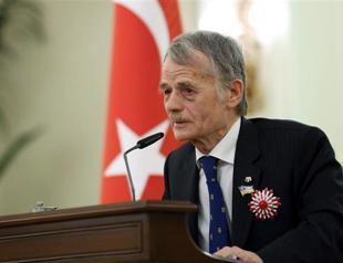 Russia bans Tatar leader from Crimea after Putin signs decree