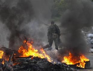 More than 30 die in ’criminal’ blaze in Ukraine, as rebels down three army helicopters