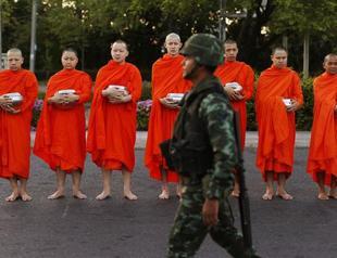 Thai junta summons ousted leaders, imposes travel ban