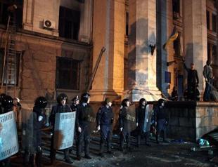 OSCE team freed in east Ukraine, where fighting rages amid a soaring national death toll