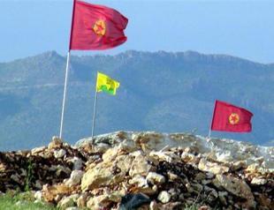 Protesters hang PKK and Öcalan flags on gendarmerie post construction site near Silvan dam