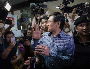 Thai army detains ex-cabinet minister at press briefing