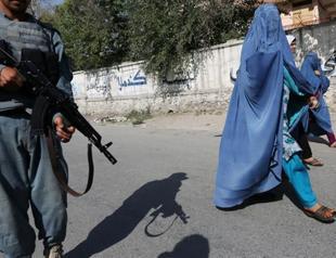 Afghans vote again in final test as Taliban threats loom