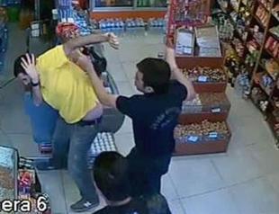VIDEO: Policeman suspended after beating shopkeeper