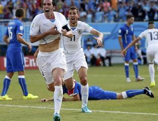 Suarez bite storm as Uruguay sink Italy