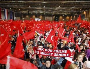 Thousands rally for Turkish PM in France, hundreds protest