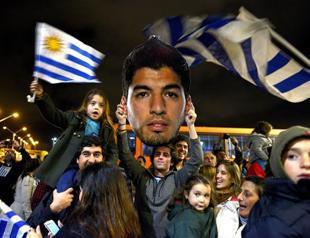 Silent Suarez back home after World Cup expulsion