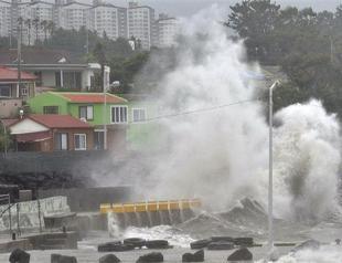 Weakened typhoon leaves two dead, heads north from Okinawa to main Japan islands