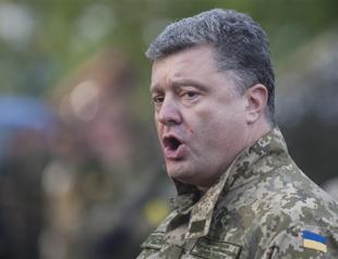 Ukraines president says Russian officers fight alongside rebels