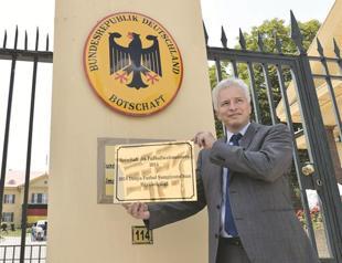 German Embassy refreshes placard with World Cup title