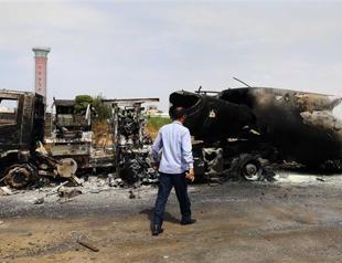 UN pulls staff out of Libya as clashes kill at least 13, close airports