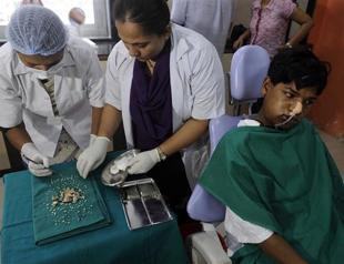 Surgeons remove 232 teeth from Indian teenager
