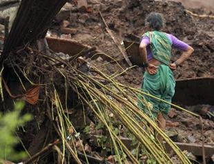 Rescuers battle rains after India landslide, 150 feared dead