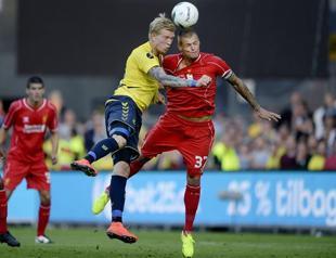 Liverpool start life after Suarez with defeat