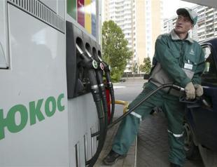 Russia hit by $50 bn Yukos ruling , amid sanctions squeeze