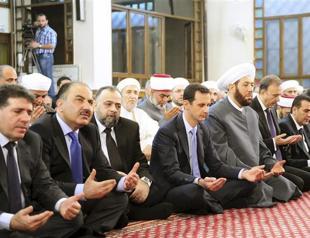Syrias Assad prays as his troops suffer high toll