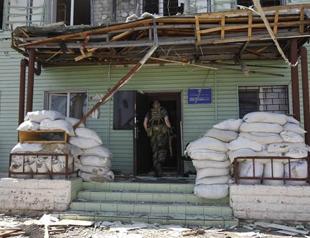 Donetsk rebels surrounded, as 13 troops killed