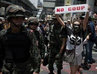 Thai anti-coup protesters defy junta ban with Bangkok march