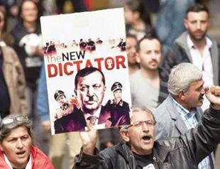 German police launch probe into poster depicting Turkish PM with Nazi symbol